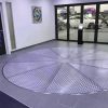 Car Turntable Platform with Pin-Gear Drive Effortlessly solve driveway challenges and limited parking access with our advanced car turntable platform. Designed for both indoor and outdoor use, this rotating platform offers smooth, reliable, and low-maintenance operation, ensuring convenience and enhanced functionality. Innovative Design and Construction Our car turntables are built with durability and precision in mind. The turntable’s pin-gear drive mechanism ensures smooth operation with minimal wear and tear, outclassing traditional friction drive systems that are prone to noise and higher maintenance. Pin Tooth Plate: Crafted from 10mm thick steel, precision-cut using CNC machinery, and treated for maximum durability. Nylon Components: High-strength nylon gears and wheels deliver superior abrasion and corrosion resistance while significantly reducing operational noise. Adjustable Height: Equipped with four supporting bolts and a central seat with adjustable shaft sleeves, the turntable can accommodate uneven installation surfaces. Seamless Functionality and Efficiency The car turntable offers unparalleled rotational capabilities, making it an ideal solution for tight parking spaces and restricted driveway access. Rotation and Capacity: Capable of 360° continuous rotation at variable speeds (0.2–1 RPM), the turntable can support weights ranging from 3,000 to 8,000 kg, making it suitable for a wide range of vehicles. Mesa Options: Choose from multiple diameter sizes (4m to 9m) and materials, including density board, plywood, and pattern aluminum alloy, to match your specific requirements. Advanced Control and Safety Features Our platform is designed with user convenience and safety in mind. Control Options: Operate the turntable using manual control, remote control, or angle-specific rotation control, ensuring precision and ease of use. Reliable Motor and Drive: The AC frequency conversion brake motor ensures smooth engagement of the main gear and stable rotation. Key Advantages Over Competitors Our car turntable stands out with its innovative design and cutting-edge features: Pin-Gear Drive Mechanism: Provides superior reliability, lower maintenance, and quieter operation compared to friction-drive systems. Noise Reduction: High-strength nylon gears and wheels significantly reduce noise levels during operation. Customizable Options: Choose from various sizes, materials, and control modes to meet your unique needs. Versatile Applications Whether you need a turntable for a residential driveway, a commercial garage, or an industrial parking lot, this platform offers unmatched versatility and performance. Upgrade your parking experience with our Car Turntable Platform with Pin-Gear Drive—a reliable and innovative solution for modern parking challenges.